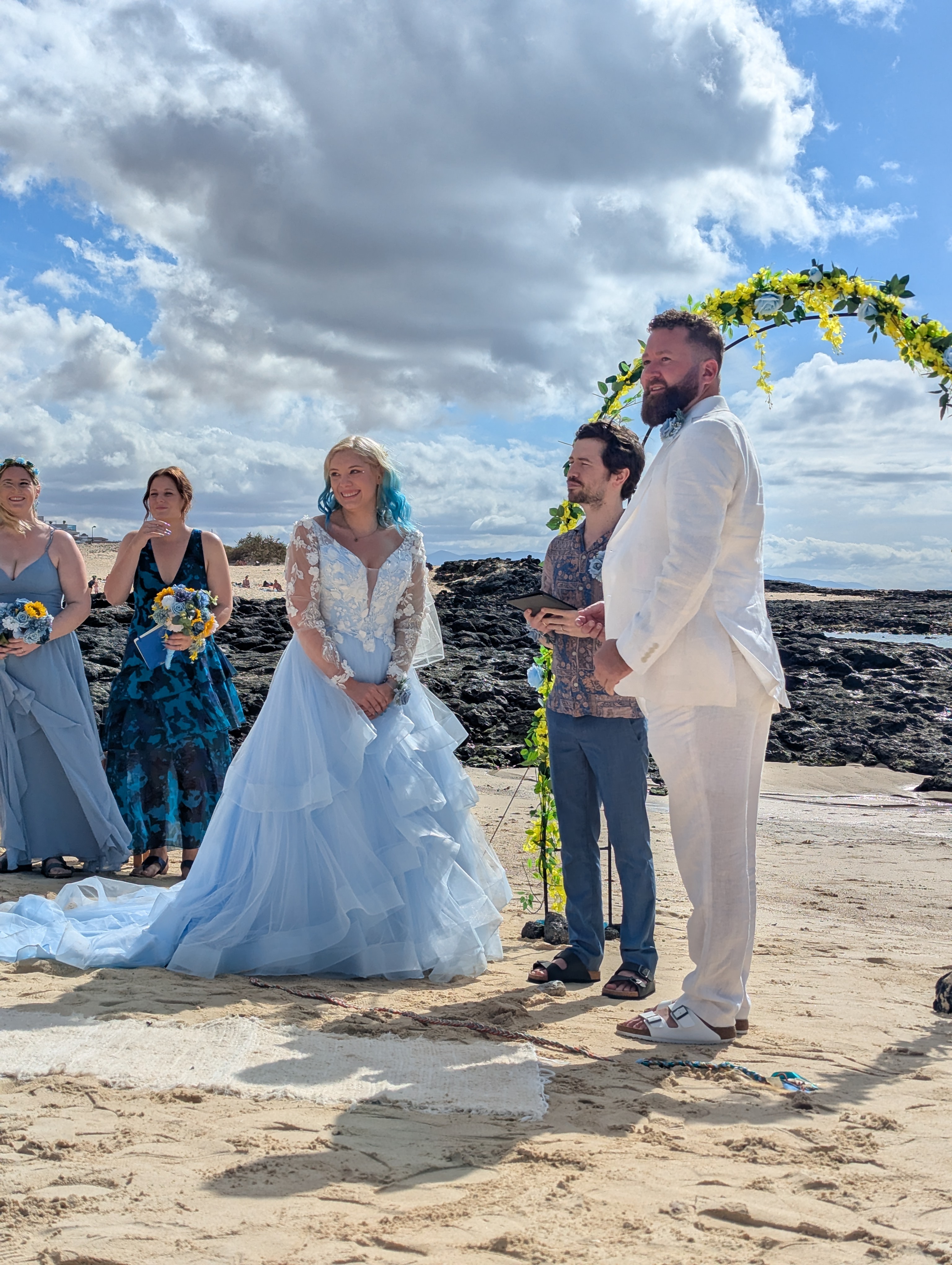 Jack and a groom in t-shirts, reviewing a ceremony script together before the day